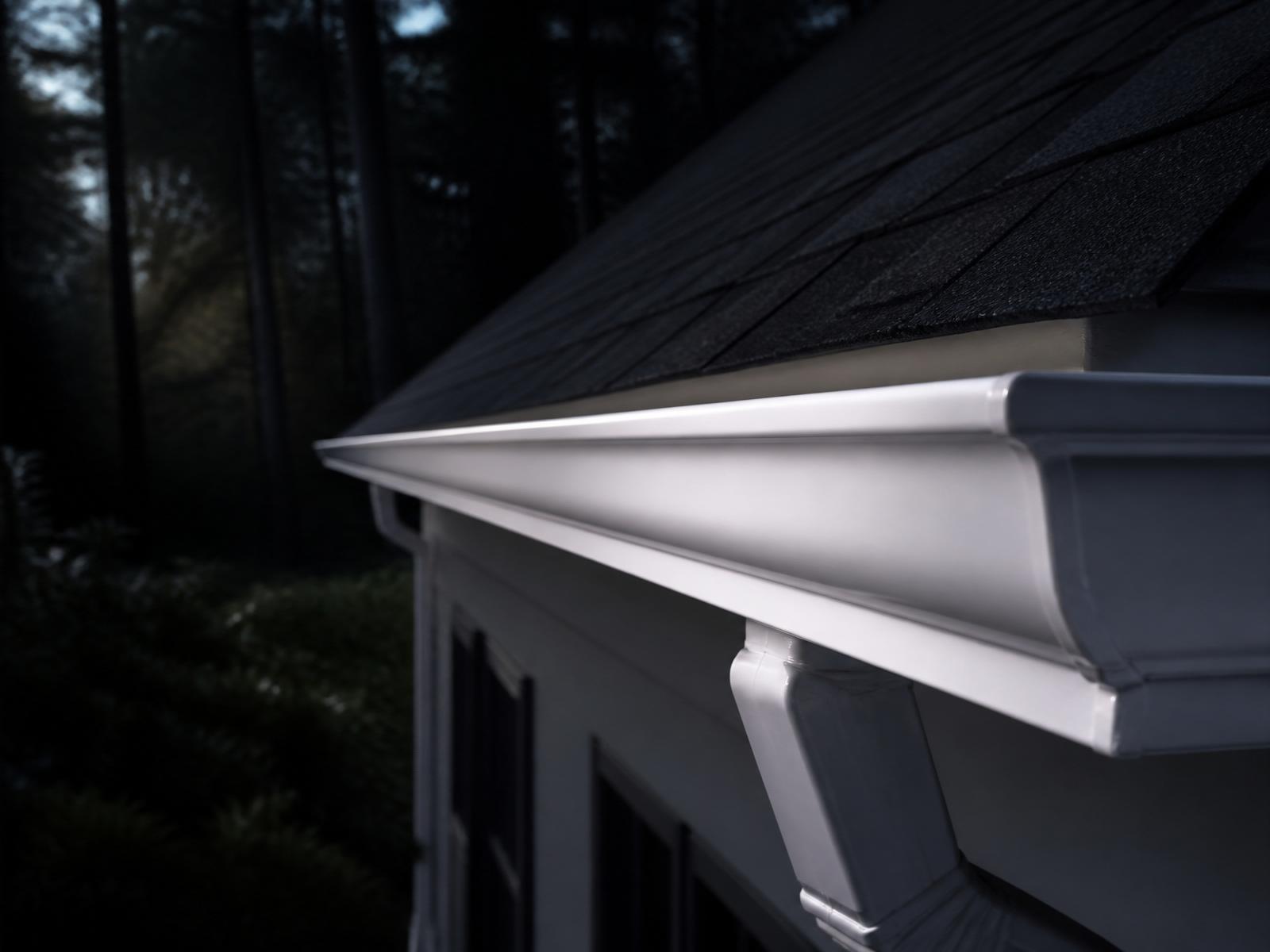 Freshly cleaned white gutters on a Tennessee home